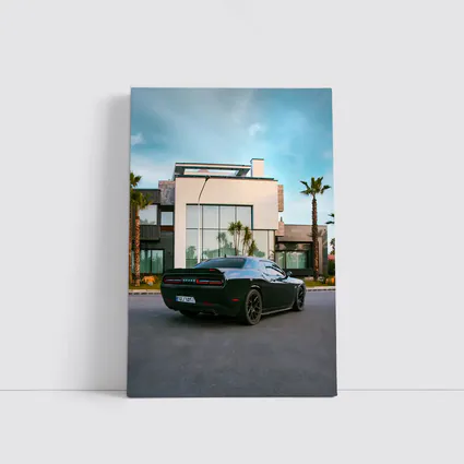 Black Dodge Challenger Parked Outside Modern Villa