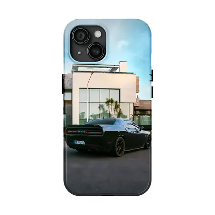 Black Dodge Challenger Parked Outside Modern Villa