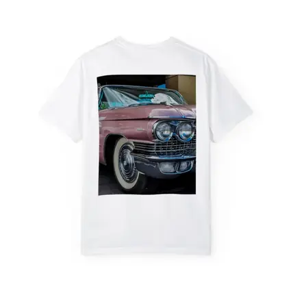 Classic Pink Cadillac Parked Outside Building
