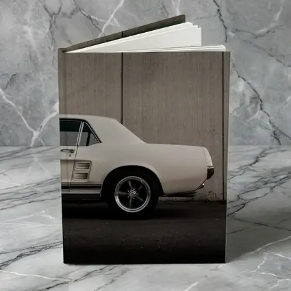Classic Ford Mustang White Against Concrete Wall