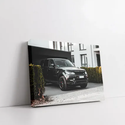 Black Range Rover Sport Parked Outside House