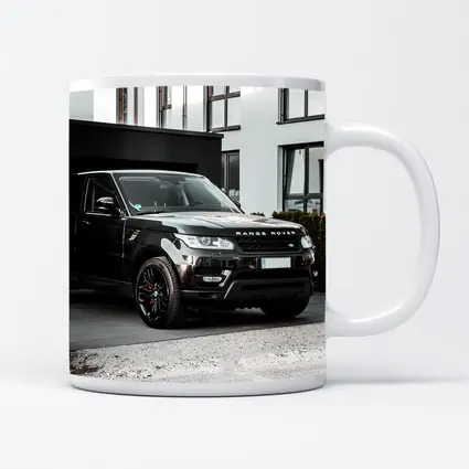 Black Range Rover Sport Parked Outside House
