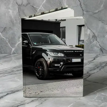 Black Range Rover Sport Parked Outside House