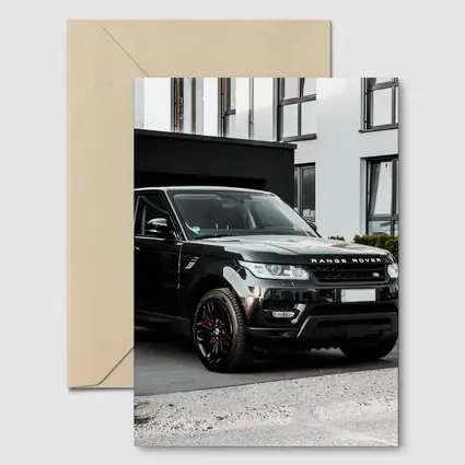 Black Range Rover Sport Parked Outside House