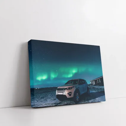 Land Rover Discovery Under Northern Lights Sky