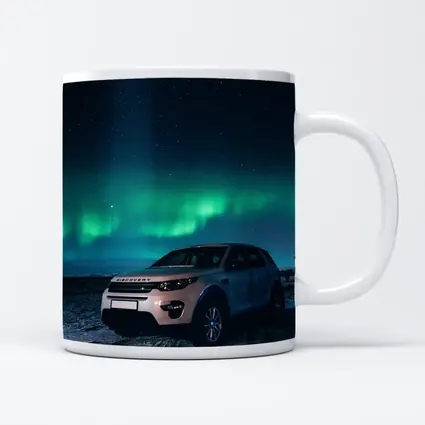 Land Rover Discovery Under Northern Lights Sky