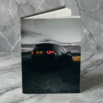 Black Land Rover Discovery Moody Dusk Sky