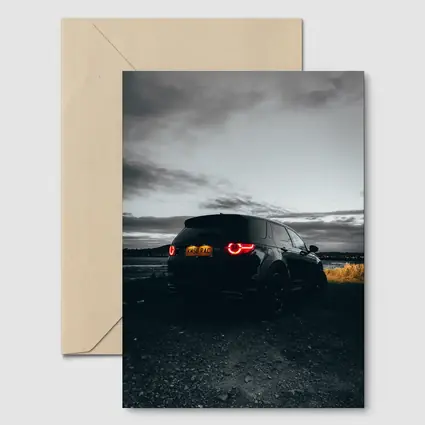 Black Land Rover Discovery Moody Dusk Sky