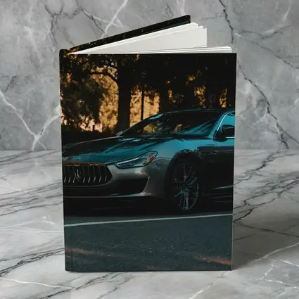 Maserati Ghibli Parked Under Evening Trees