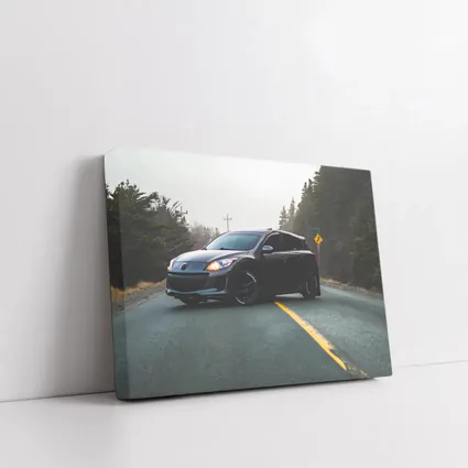 Mazda 3 Hatchback on Foggy Forest Road