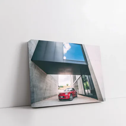 Red Mazda MX-5 Parked Under Modern Architecture