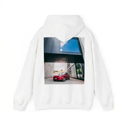 Red Mazda MX5 Parked Under Modern Architecture