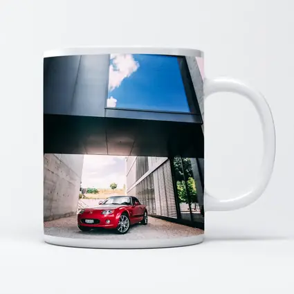 Red Mazda MX5 Parked Under Modern Architecture