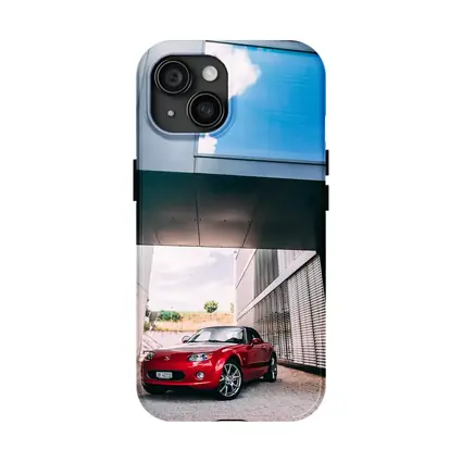 Red Mazda MX5 Parked Under Modern Architecture