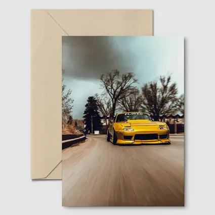 Yellow Mazda RX-7 Racing Through City Street