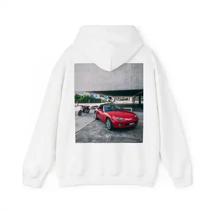 Red Mazda MX5 Parked Near Concrete Structure