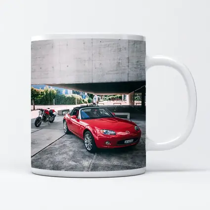 Red Mazda MX5 Parked Near Concrete Structure