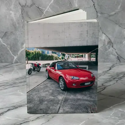 Red Mazda MX5 Parked Near Concrete Structure