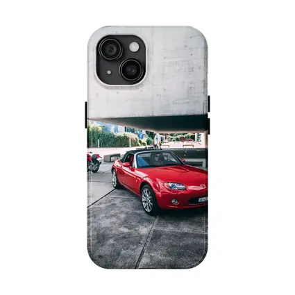 Red Mazda MX5 Parked Near Concrete Structure