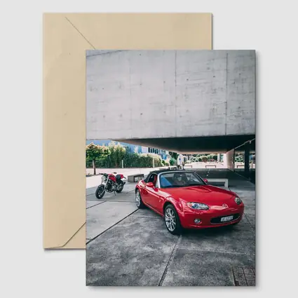 Red Mazda MX5 Parked Near Concrete Structure