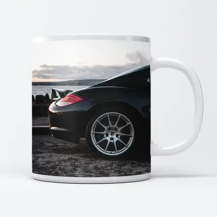 Black Porsche Cayman By Coastal Waterfront