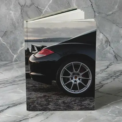 Black Porsche Cayman By Coastal Waterfront