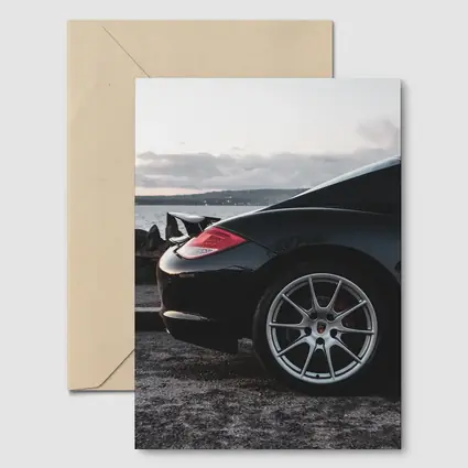 Black Porsche Cayman By Coastal Waterfront