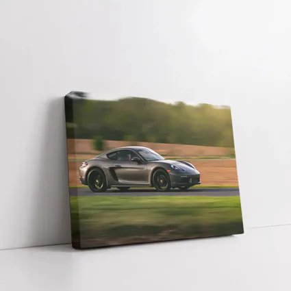 Porsche Cayman Speeding Along Country Road