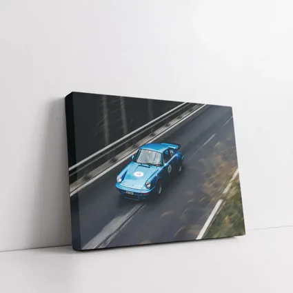 Blue Porsche 911 Racing on Mountain Road