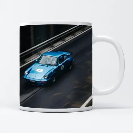 Blue Porsche 911 Racing on Mountain Road