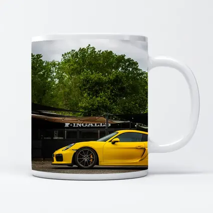 Yellow Porsche Cayman GT4 Street Parked