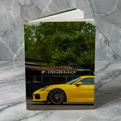 Yellow Porsche Cayman GT4 Street Parked