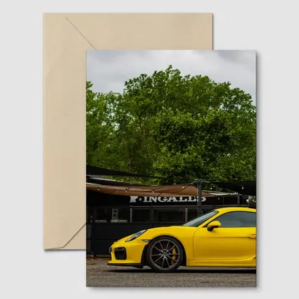 Yellow Porsche Cayman GT4 Street Parked