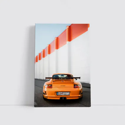 Porsche GT3 RS Orange Against Industrial Wall