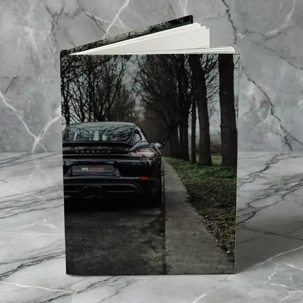 Black Porsche Cayman Rear View Moody Road