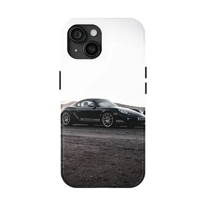 Black Porsche Cayman Parked on Rugged Terrain