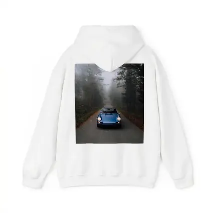 Blue Porsche 911 on Foggy Forest Road