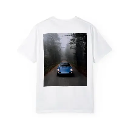 Blue Porsche 911 on Foggy Forest Road