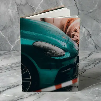 Teal Porsche Cayman At Snowy Car Wash