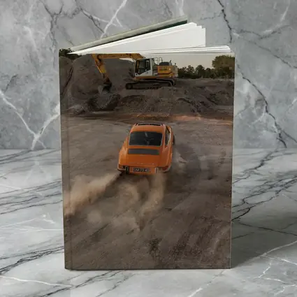 Orange Porsche 911 Drifting Dusty Gravel Quarry
