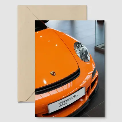Porsche 911 Orange Front Dealership Interior