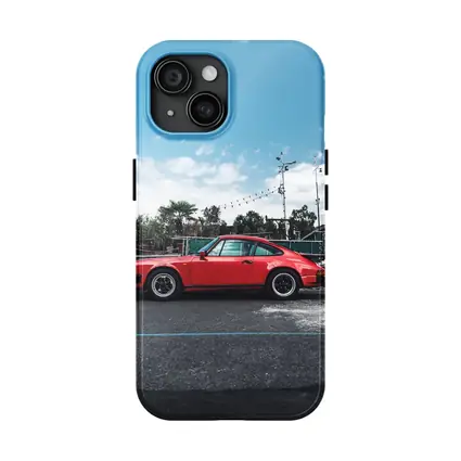 Red Porsche 911 Parked Under Blue Sky