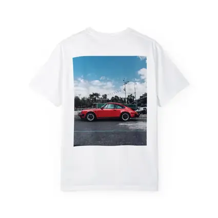 Red Porsche 911 Parked Under Blue Sky