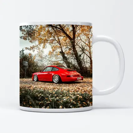 Red Porsche 911 Parked Among Autumn Leaves