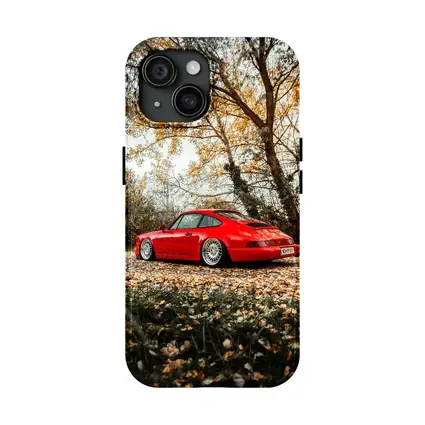 Red Porsche 911 Parked Among Autumn Leaves