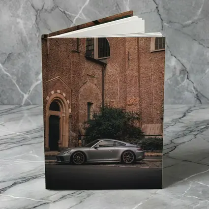 Porsche 911 GT3 Silver Beside Brick Church