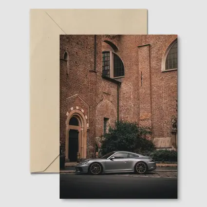 Porsche 911 GT3 Silver Beside Brick Church