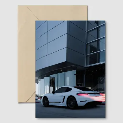 Porsche Cayman White Outside Modern Glass Building