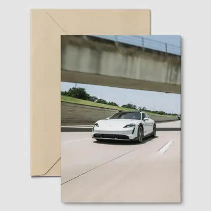 Porsche Taycan White on Open Highway