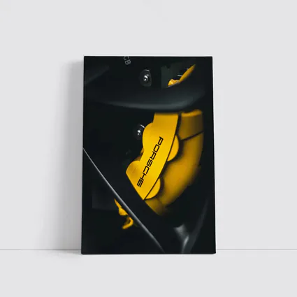 Porsche Yellow Brake Caliper Dark Background